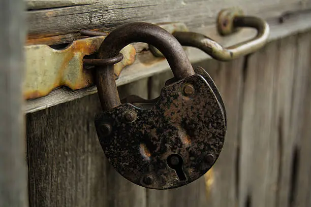old lock without a key, wooden door