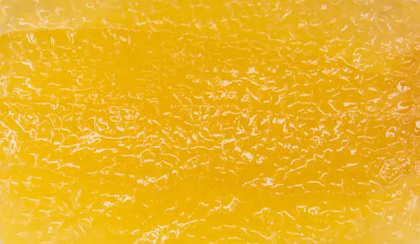 yellow abstract textured background, juicy lemon slice