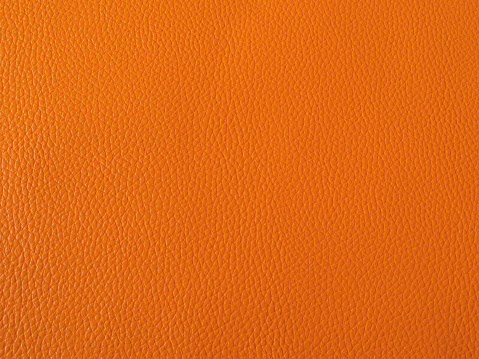 Orange artificial leather texture background