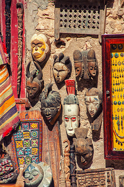 Touristic souvenir shop in the middle of Medina quarter in Essaouira, Morocco. Stylish wooden masks on the wall, other craft