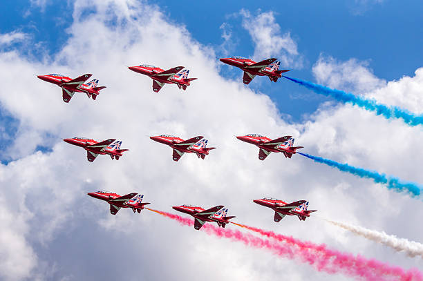 Royal Air Force Red Arrows Display Team Dawlish, United Kingdom - August 23, 2014: The Royal Airforce Red Arrows Aerobatics Display Team Flying in Diamond Formation at the Dawlish Airshow british aerospace stock pictures, royalty-free photos & images