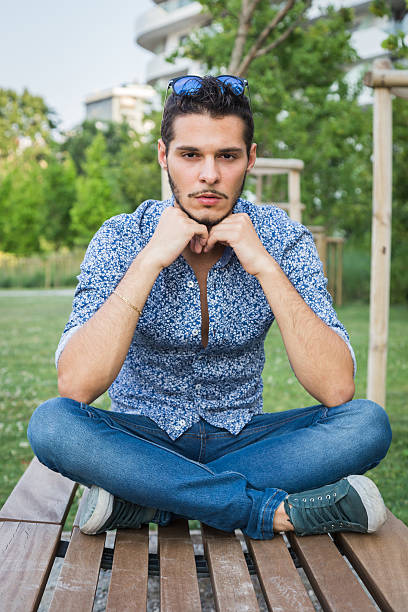istock Young handsome man posing in a city park 501254212