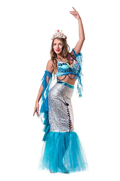 Carnival dancer girl dressed as a mermaid posing, isolated on white background in full length.