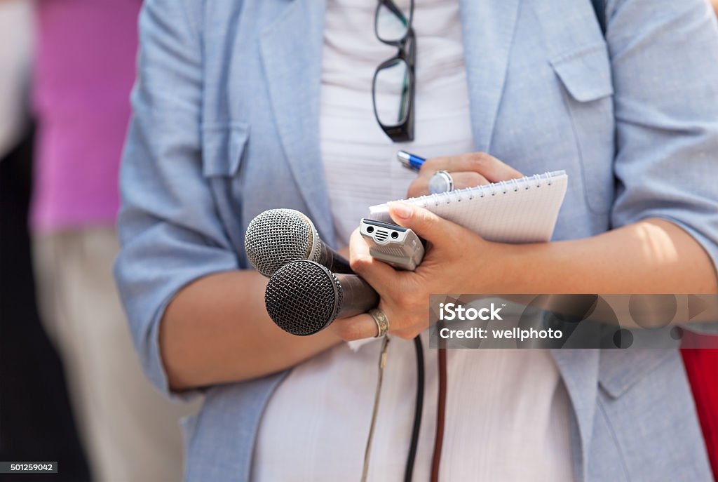 Journalist. News conference. Reporter. Taking notes. Media interview. Journalist Stock Photo