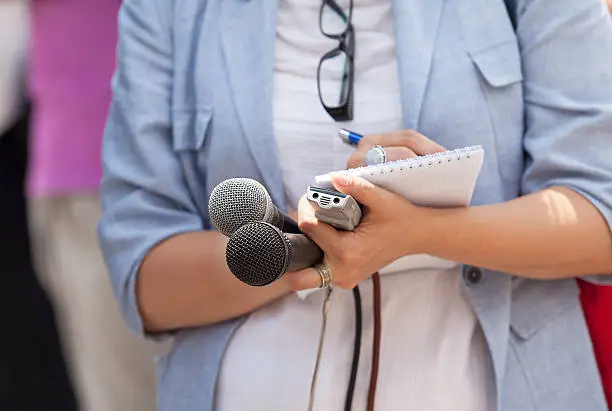 Photo of Journalist. News conference.