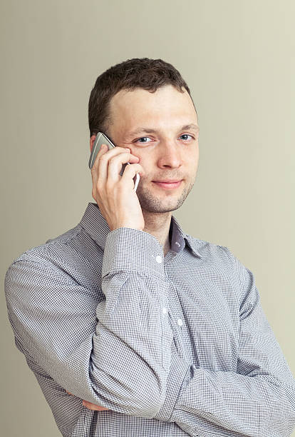 istock Young Caucasian Man with mobile phone, casual studio portrait 501259671