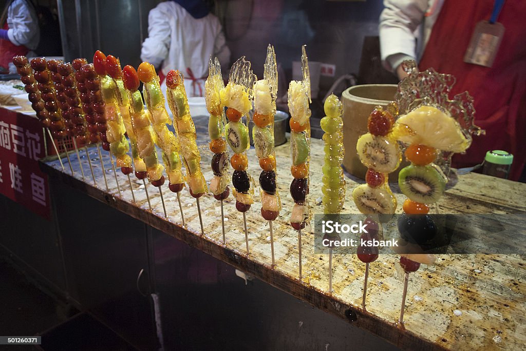 Sugar coating fruit skew at Wangfujing, Beijing Sugar coating fruit skew at Wangfujing, Beijing. Tanghulu, also called bing tanghulu, is a traditional winter snack in northern China, especially in Beijing. Fruit Stock Photo