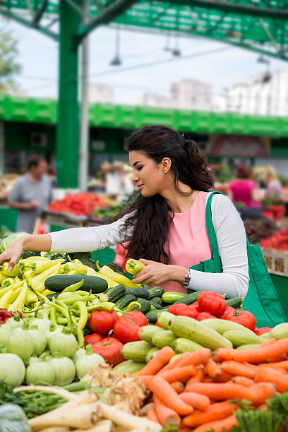 istock Young woman on the market 501261051