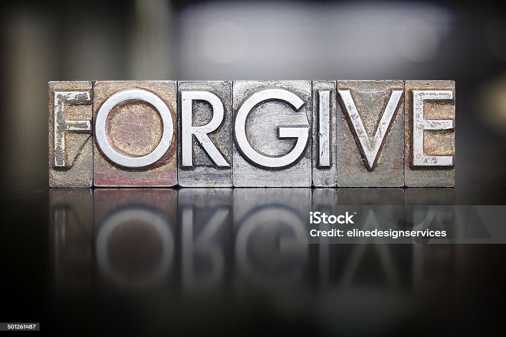 Forgive Letterpress The word FORGIVE written in vintage letterpress type Forgiveness Stock Photo