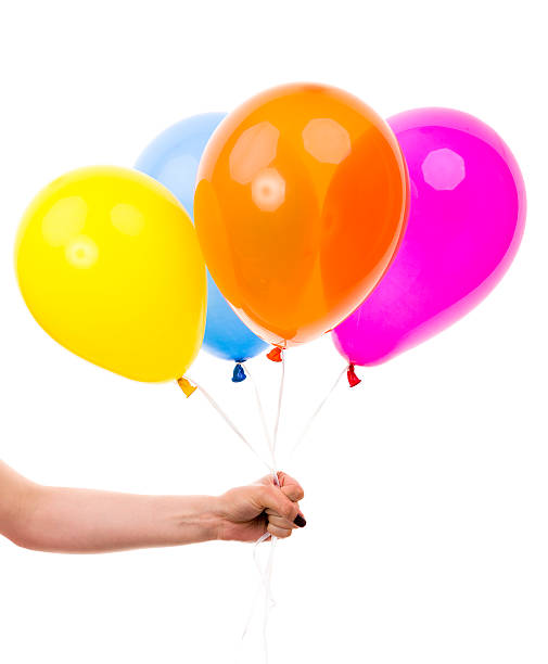 istock Colorful Balloons held by Female Hand. On White Background 501261493