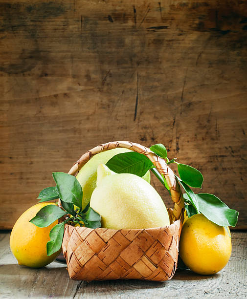 istock Fresh lemons with leaves in a wicker basket 501262390
