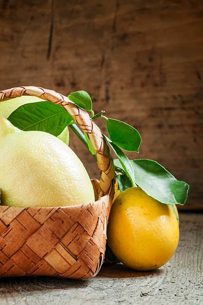 istock Fresh lemons with leaves in a wicker basket 501262536