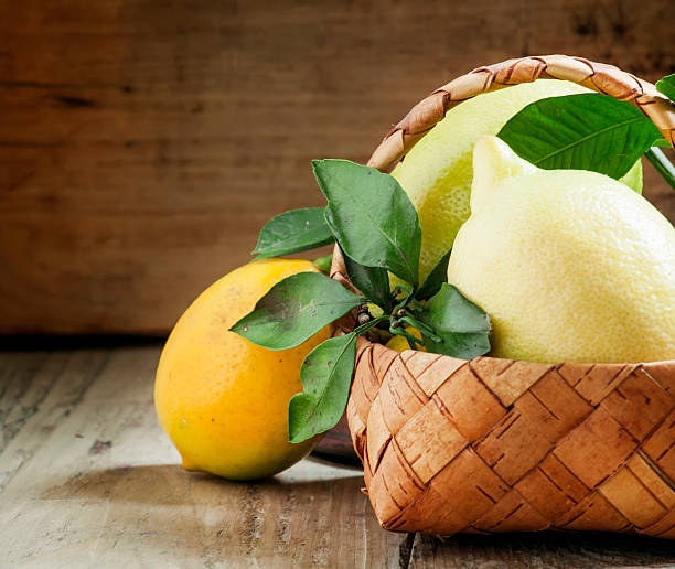 istock Fresh lemons with leaves in a wicker basket 501263158