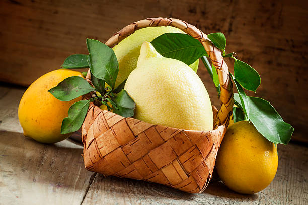 istock Fresh lemons with leaves in a wicker basket 501263366