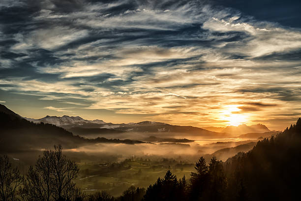 spectacular sunset over landscape at European alps in winter View from Allgäu in Germany (Obersdorf) over the Austrian Vorarlberg till to the Alpstein and Mountain Säntis in Switzerland in the background. allgau stock pictures, royalty-free photos & images