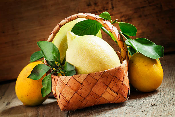 istock Fresh lemons with leaves in a wicker basket 501263488