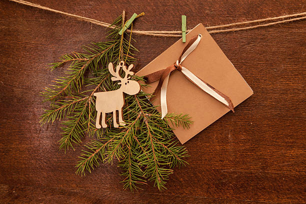 istock Pine branches. deer  and postcard  on wooden panels 501263984