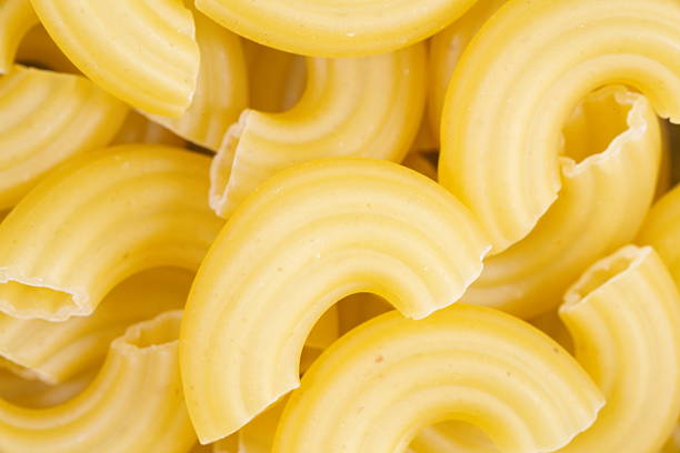 istock Raw italian food  pasta macaroni on white 501265095