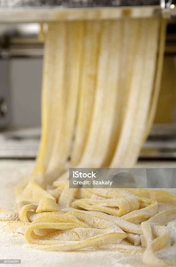 pasta dough is being processed homemade pasta dough is being processed Cultures Stock Photo
