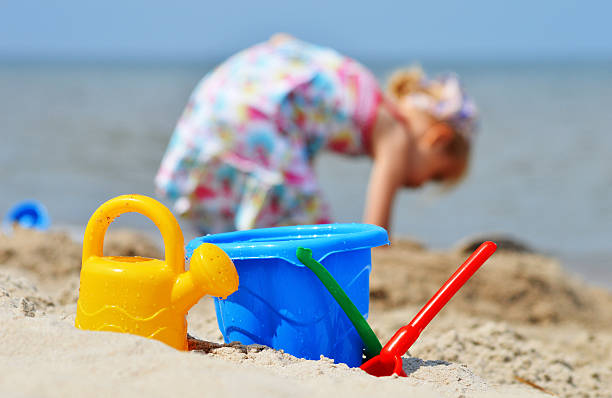 Little girl building a sandcastle
