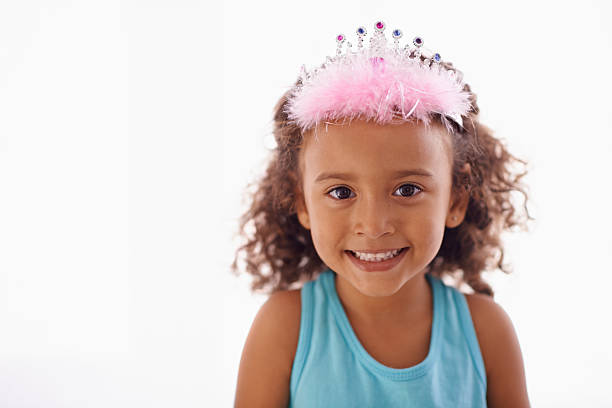 Studio portrait of an adorable little girl in a tiara isolated on whitehttp://195.154.178.81/DATA/i_collage/pi/shoots/783539.jpg