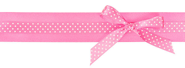 istock Pink polka dot ribbon with a bow 501281781
