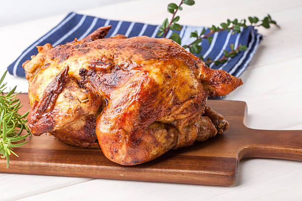 istock Baked chicken on wooden board. 501282768
