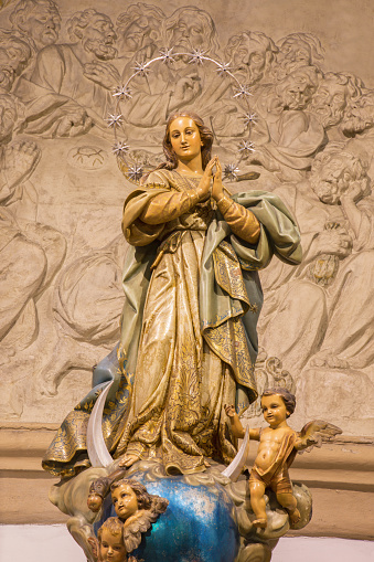 Malaga - The carved and polychrome Immaculate Conception statue in church Iglesia del Santiago Apostol by unknown artist of 20. cent. from Valencia.
