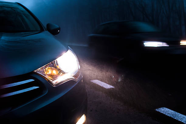 Car Traffic At Night Road traffic in the dark. headlight stock pictures, royalty-free photos & images