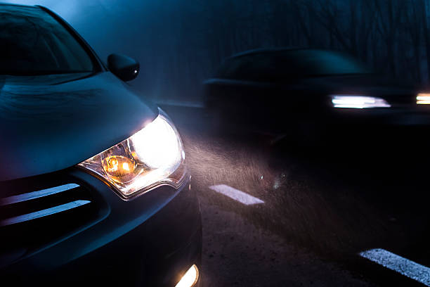 Car Traffic At Night Road traffic in the dark. headlamp stock pictures, royalty-free photos & images