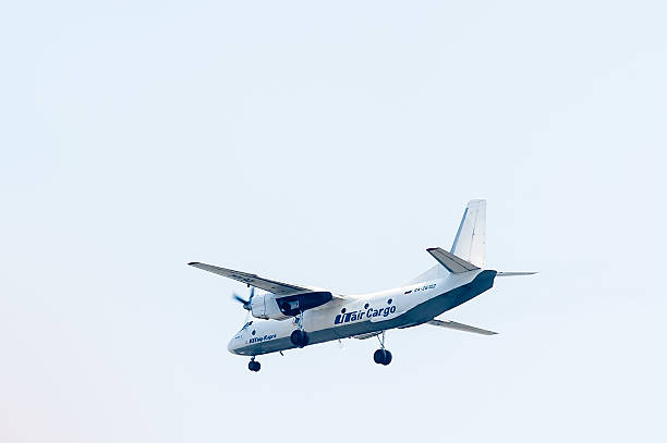 Flying AN-26B of Utair Cargo company Tyumen, Russia - August 11, 2012: On a visit at UTair airshow in heliport Plehanovo. Flying AN-26B of Utair Cargo company antonov an 26 stock pictures, royalty-free photos & images