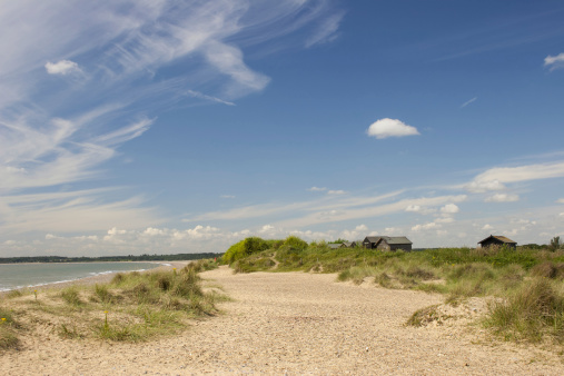 Fishermen's huts in the dunes behind Walberswick beach on the Suffolk coast. Captured on a July morning.