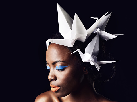 Cropped shot of a beautiful ethnic woman posing with origami birds on her headhttp://195.154.178.81/DATA/i_collage/pi/shoots/783612.jpg