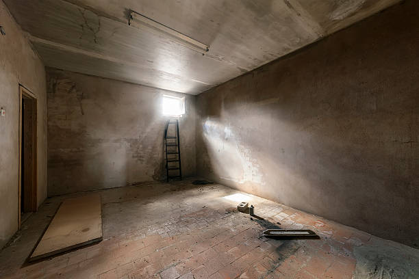 istock Abandoned empty room with window and rays of light 501295052