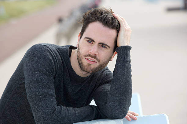 istock Young man posing with hand in hair 501295117