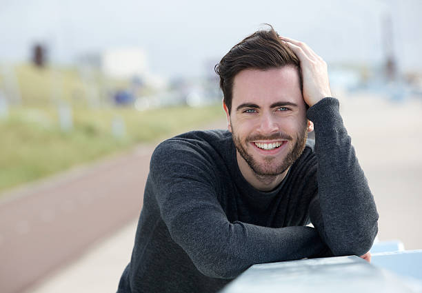 istock Happy man posing with hand in hair 501295119