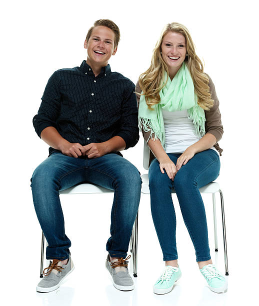istock Smiling couple sitting on chair 501295122