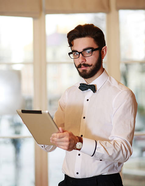 istock Young businessman working in office with tablet 501295126