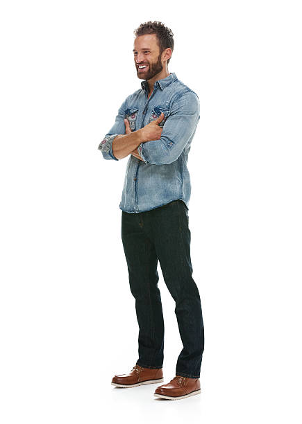 istock Smiling man standing with arms crossed 501295256