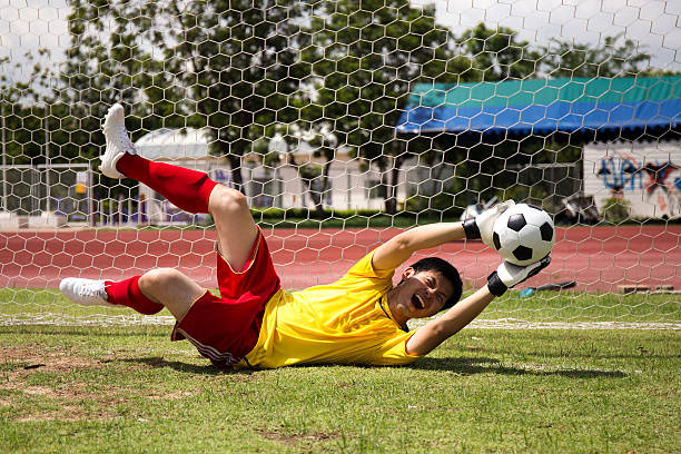 Goalkeeper catches the ball