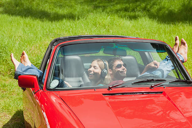 istock Smiling young couple relaxing in classy cabriolet 501295875