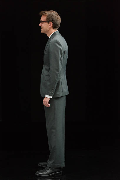 istock Smiling businessman standing and looking away 501295912