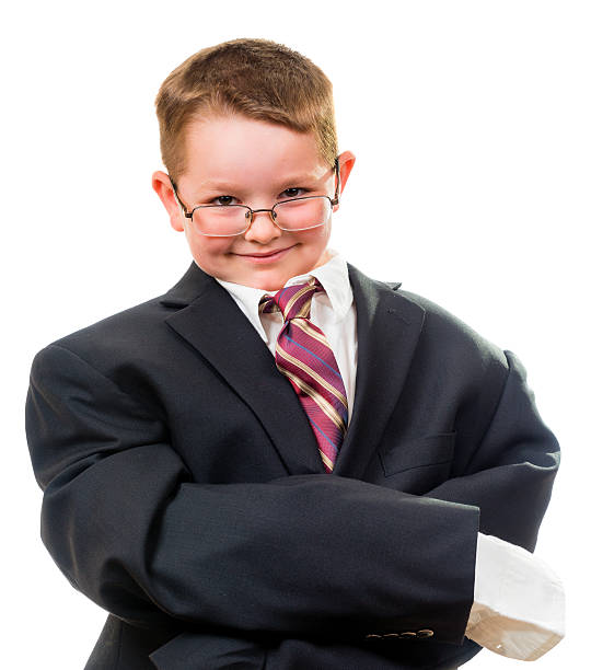 istock Child wearing suit that is too big 501296549