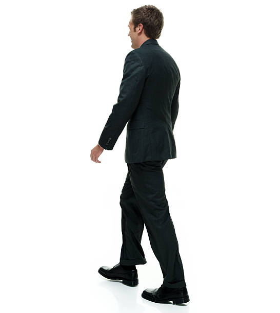 istock Rear view of businessman walking 501297658