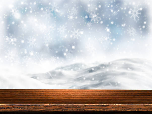 istock 3D wooden table with snowy background 501333120