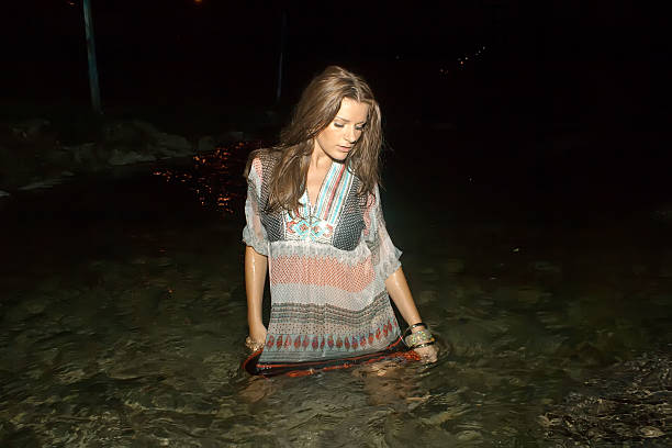 istock Beautiful young woman in the river 501334615