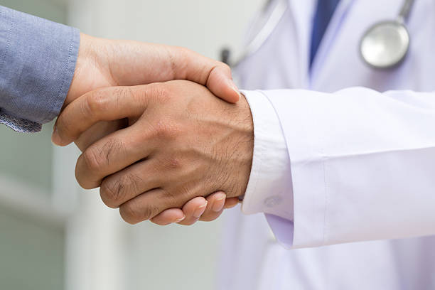 istock Doctor shakes hands with a patient 501334672