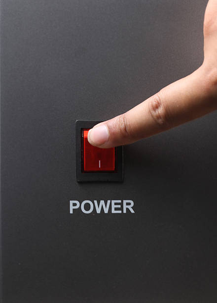 istock Asian male hand turning off red power switch 501334968