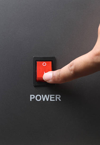 istock Asian male hand turning on red power switch 501334990