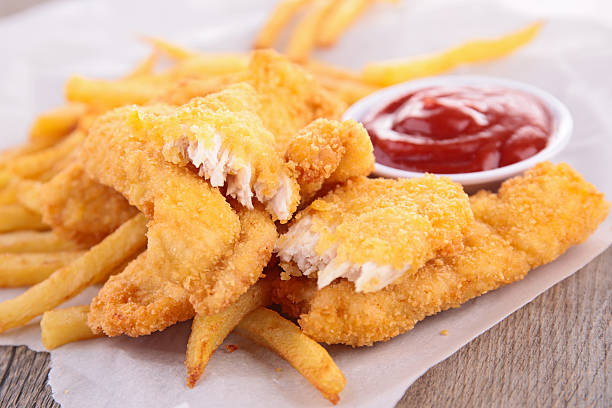 istock french fries and fried chicken nuggets 501334995